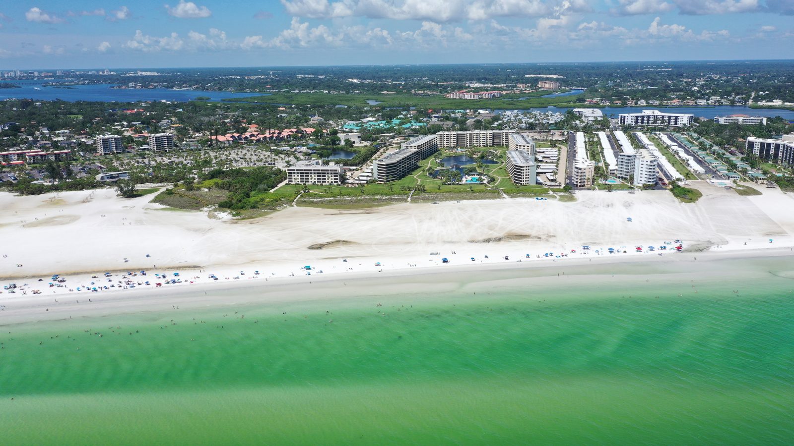 Gulf & Bay Club Beachfront seen from over the Gulf: the buildings sit in the front row on Siesta Key